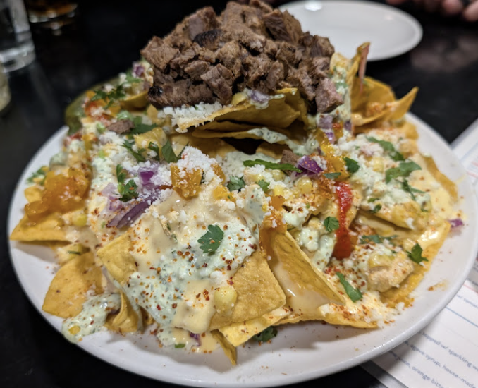 Redbird Scratch Kitchen + Bar signature dishes Elote Nachos
Waffles Fries
Redbird Classic Burger